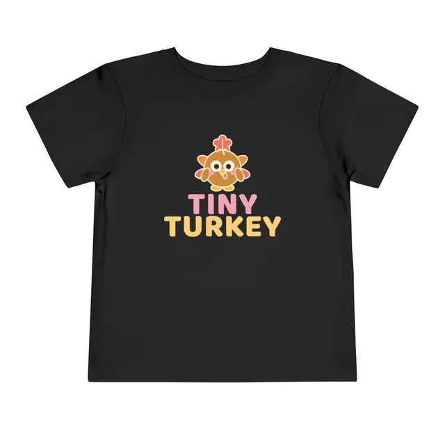 Tiny Turkey toddler tee in black with a cheerful turkey
